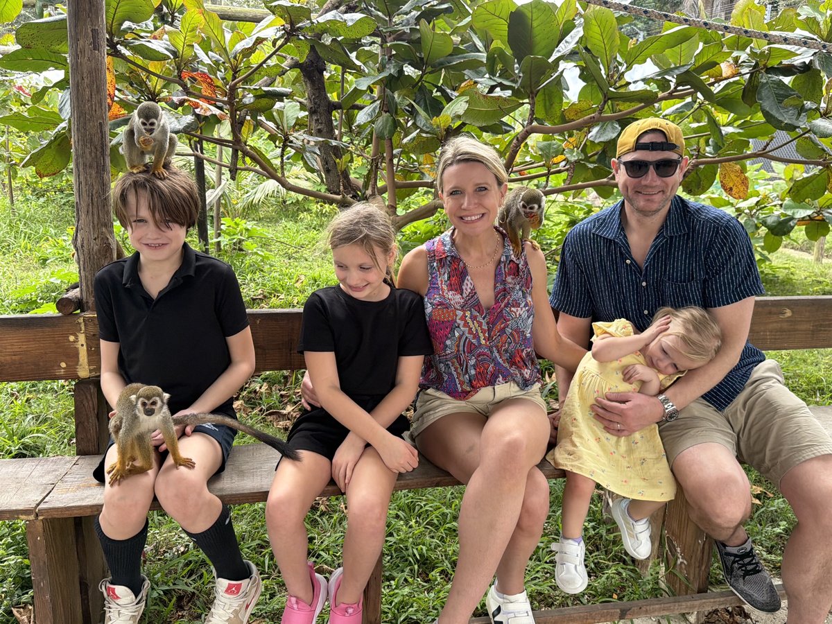Family with squirrel monkeys in the Dominican Republic